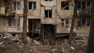 A view of a crater from an explosion near to a residential building, heavily damaged after a Russian attack in Kharkiv, Ukraine. (AP) A view of a crater from an explosion near to a residential building, heavily damaged after a Russian attack in Kharkiv, Ukraine. (AP)