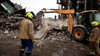 Rescuers work among remains of residential building destroyed by Russian shelling,as they search for bodies, amid Russia's Invasion of Ukraine is seen in Borodyanka, Kyiv region. (REUTERS)
