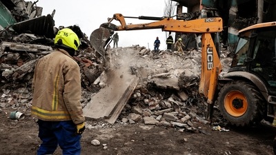 Rescuers work among remains of residential building destroyed by Russian shelling,as they search for bodies, amid Russia's Invasion of Ukraine is seen in Borodyanka, Kyiv region. (Reuters)