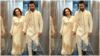 Vicky complemented his wife in a matching white embroidered short bandhgala kurta and churidar pants. He teamed it with an embroidered half-sleeved Nehru jacket, yellow pocket scarf, brown dress shoes, groomed beard and backswept hairdo. What do you think of the couple's all-white look? (Instagram/@lokhandeankita) Vicky complemented his wife in a matching white embroidered short bandhgala kurta and churidar pants. He teamed it with an embroidered half-sleeved Nehru jacket, yellow pocket scarf, brown dress shoes, groomed beard and backswept hairdo. What do you think of the couple's all-white look? (Instagram/@lokhandeankita)