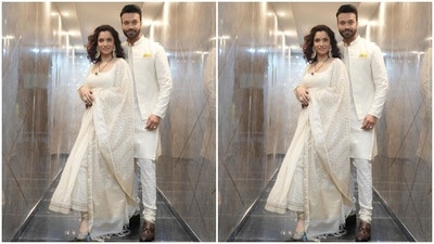 Ankita teamed the anarkali kurta with matching white churidar pants and a dupatta, which she draped on her shoulder. It comes with a coin print, tassels, and a gold patti on the border. (Instagram/@lokhandeankita) Ankita teamed the anarkali kurta with matching white churidar pants and a dupatta, which she draped on her shoulder. It comes with a coin print, tassels, and a gold patti on the border. (Instagram/@lokhandeankita)
