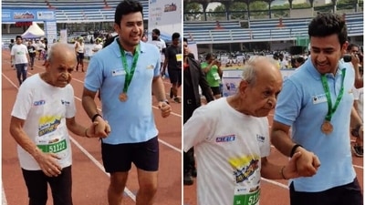 BJP MP Tejaswi Surya hold the hand of a 92-year-old man as they crosses the finish line of a 5K marathon. BJP MP Tejaswi Surya hold the hand of a 92-year-old man as they crosses the finish line of a 5K marathon.