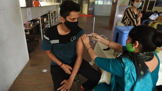 A person gets a dose of Covid-19 vaccine at the district hospital in Noida’s Sector 30 on Sunday. (Sunil Ghosh /HT)