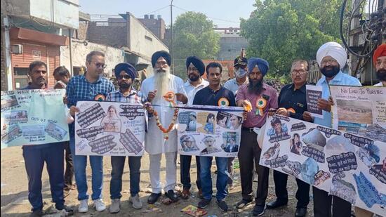 PAC members and activists protesting against Ludhiana MC over open garbage dump in Ludhiana on April 10, 2022. (Gurpreet Singh/HT)