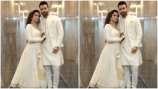 Ankita chose a white embroidered anarkali suit set for the photoshoot. The anarakli kurta features a wide U neckline, fitted bodice, a flared skirt, intricate coin embroidery, gota patti border on the hemline, printed full sleeves with patti-adorned cuffs, and an ankle-length hem.(Instagram/@lokhandeankita)
