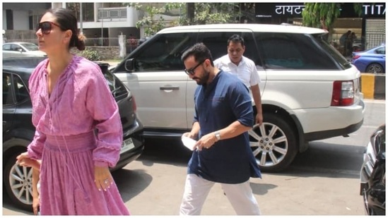 Paparazzi clicked Kareena and Saif getting out of their car and going inside a restaurant in Mumbai. The pictures showed Kareena holding Taimur's hand as Saif followed the mother-son duo. While Kareena went for a midi dress, Saif chose a traditional outfit.(HT Photo/Varinder Chawla)
