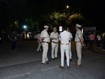 Police personnel stand guard at JNU entrance after a scuffle broke out between two groups on Apirl 10.&nbsp;