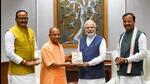 Uttar Pradesh chief minister Yogi Adityanath and deputy chief ministers Keshav Prasad Maurya and Brajesh Pathak with Prime Minister Narendra Modi in New Delhi on Monday. (PTI PHOTO) Uttar Pradesh chief minister Yogi Adityanath and deputy chief ministers Keshav Prasad Maurya and Brajesh Pathak with Prime Minister Narendra Modi in New Delhi on Monday. (PTI PHOTO)