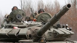 Ukraine war: Service members of pro-Russian troops drive a tank during Ukraine-Russia conflict on a road outside the southern port city of Mariupol,