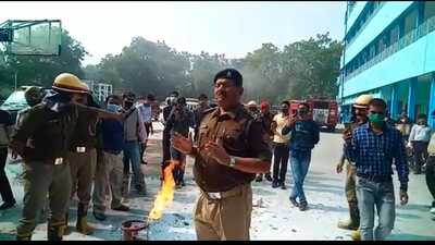 Fire department officials giving safety tips to check LPG leakage, in Prayagraj. (HT photo)