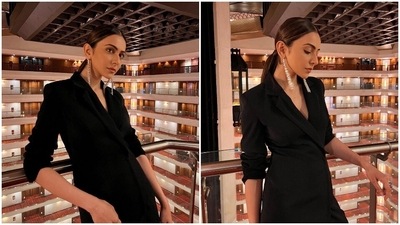 The dress features a lapel collar neck and full sleeves with multi-colour chain mail detailing at the hemline. (Instagram/@rakulpreet)