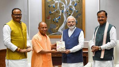 Uttar Pradesh chief minister Yogi Adityanath and deputy chief ministers Keshav Prasad Maurya and Brajesh Pathak with Prime Minister Narendra Modi in New Delhi on Monday. (PTI PHOTO) Uttar Pradesh chief minister Yogi Adityanath and deputy chief ministers Keshav Prasad Maurya and Brajesh Pathak with Prime Minister Narendra Modi in New Delhi on Monday. (PTI PHOTO)