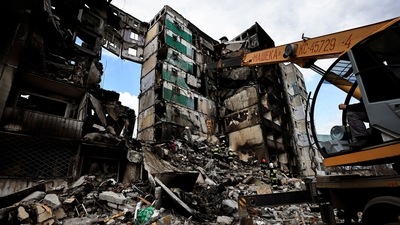 A rescuer walks during a search operation for bodies under the rubble of a building destroyed by Russian shelling, amid Russia's Invasion of Ukraine, in Borodyanka, Kyiv region. (REUTERS)