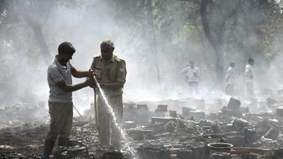 Firefighters douse the flames at a cow shelter in Kanawani village in Ghaziabad on Monday. (Sakib Ali/ HT) Firefighters douse the flames at a cow shelter in Kanawani village in Ghaziabad on Monday. (Sakib Ali/ HT)