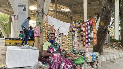 Dressed in a purple sari, the vendor says she has two names. (HT Photo) Dressed in a purple sari, the vendor says she has two names. (HT Photo)