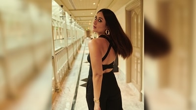 Kareena Kapoor's jumpsuit is from the international luxury clothing line Herve Leger. The jumpsuit features an open back with bandage straps and wide bottoms. (Instagram/@kareenakapoorkhan) Kareena Kapoor's jumpsuit is from the international luxury clothing line Herve Leger. The jumpsuit features an open back with bandage straps and wide bottoms. (Instagram/@kareenakapoorkhan)