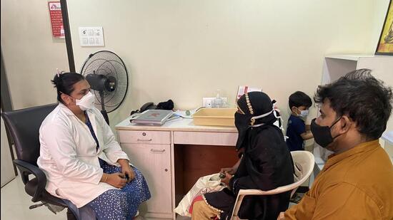 Shehnaz Khan and her husband Yunus with a counsellor at the MSF clinic in Govandi. (Ht Photo)