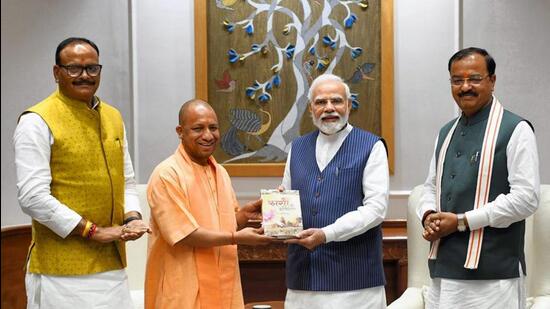 Uttar Pradesh chief minister Yogi Adityanath and deputy chief ministers Keshav Prasad Maurya and Brajesh Pathak with Prime Minister Narendra Modi in New Delhi on Monday. (PTI PHOTO)