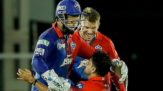 Kuldeep Yadav of Delhi Capitals celebrates after picking a wicket with captain Rishabh Pant and David Warner.(PTI)