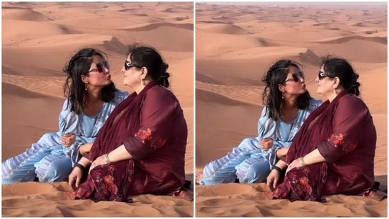 One of the pictures shows Hina looking at her mom lovingly and making a goofy kissing face. She shared the adorable image with a 'Maa' and evil eye amulet sticker. The mother-daughter duo sat on the dunes to get it clicked.(Instagram/@realhinakhan)