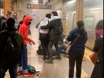 This photo provided by Will B Wylde, a person is aided outside a subway car in the Brooklyn borough of New York.