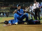 MS Dhoni and Yuvraj Singh pose on the wicket after India won the 2011 ICC World Cup trophy at Wankhede stadium in Mumbai. MS Dhoni and Yuvraj Singh pose on the wicket after India won the 2011 ICC World Cup trophy at Wankhede stadium in Mumbai.