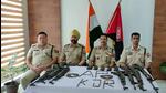 Senior Assam Police officials with the recovered arms. (ASSAM POLICE) Senior Assam Police officials with the recovered arms. (ASSAM POLICE)