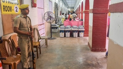 Kolkata: A security officer stands at guard outside a 'strong room', where Electronic Voting Machines (EVMs) are kept, on the eve of the Ballygunge Assembly by-polls, (PTI) Kolkata: A security officer stands at guard outside a 'strong room', where Electronic Voting Machines (EVMs) are kept, on the eve of the Ballygunge Assembly by-polls, (PTI)