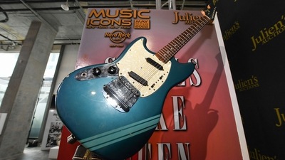 The blue 1969 Mustang Fender guitar used by rock icon Kurt Cobain in the 1991 Nirvana music video Smells Like Teen Spirit. (AFP) The blue 1969 Mustang Fender guitar used by rock icon Kurt Cobain in the 1991 Nirvana music video Smells Like Teen Spirit. (AFP)