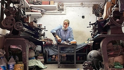 In his early 70s, his serene face with a long white beard now gazes out into the street at Gali Qasim Jan in Old Delhi’s Ballimaran. In his early 70s, his serene face with a long white beard now gazes out into the street at Gali Qasim Jan in Old Delhi’s Ballimaran.