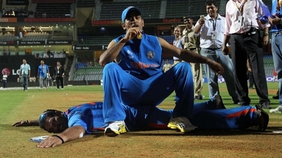MS Dhoni and Yuvraj Singh pose on the wicket after India won the 2011 ICC World Cup trophy at Wankhede stadium in Mumbai. ( HT Photo by Santosh Harhare) MS Dhoni and Yuvraj Singh pose on the wicket after India won the 2011 ICC World Cup trophy at Wankhede stadium in Mumbai. ( HT Photo by Santosh Harhare)