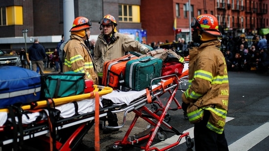 Emergency personnel work at the scene of a shooting at a subway station in the Brooklyn borough of New York City, New York, US, April 12, 2022. (REUTERS/Eduardo Munoz)