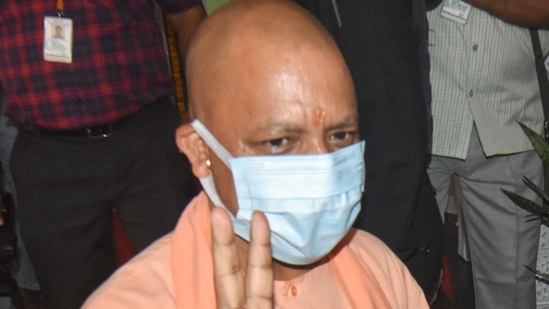 Gorakhpur: UP Chief Minister Yogi Adityanath flashes victory sign after casting his vote for MLC elections, in Gorakhpur on Saturday, (PTI)