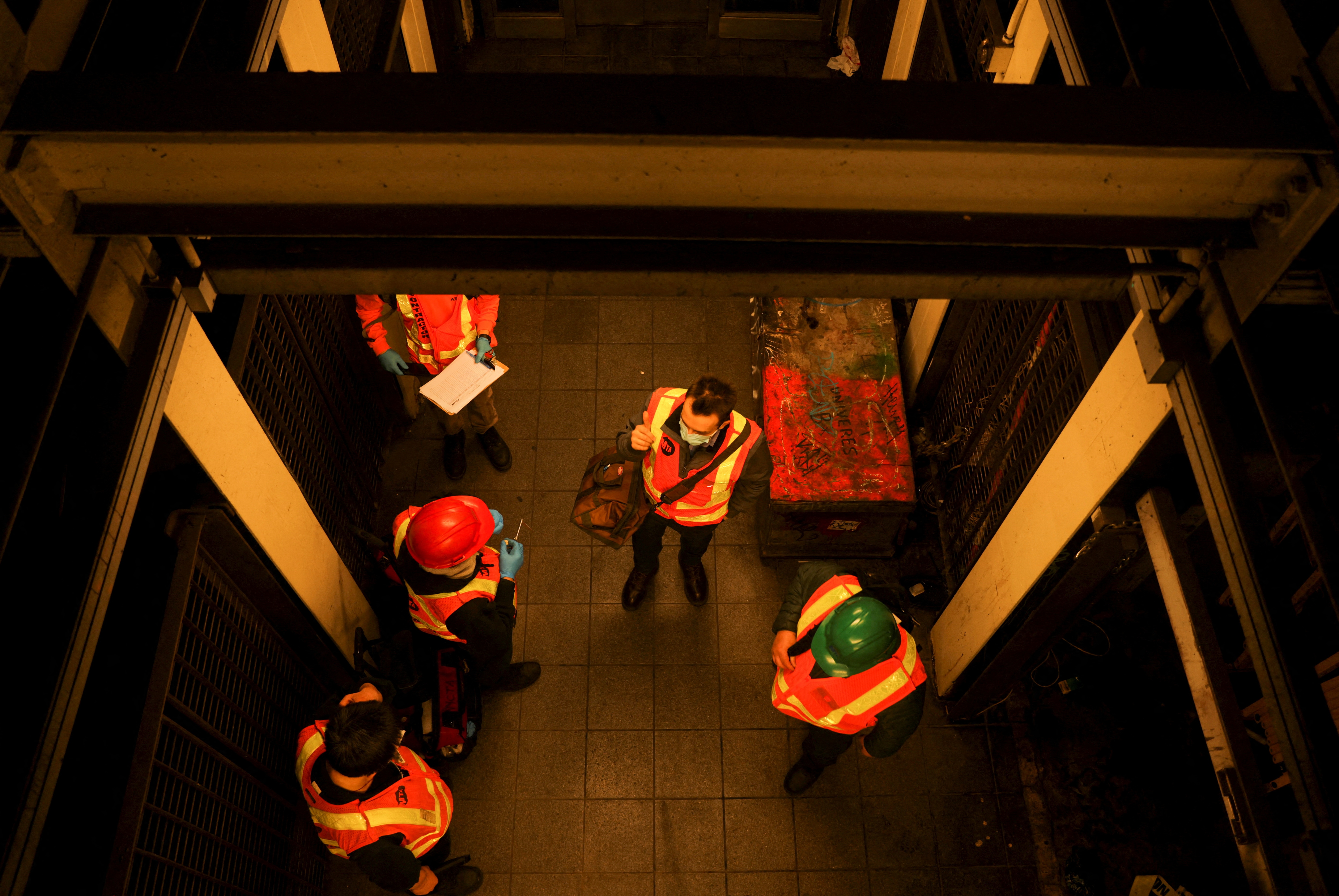 Metropolitan Transportation Authority workers check Manhattan subways after a shooting at a subway station in the Brooklyn borough of New York City. (REUTERS)