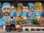 A motorist passes by a mural of frontline workers against coronavirus at RK Puram in New Delhi.(HT file) A motorist passes by a mural of frontline workers against coronavirus at RK Puram in New Delhi.(HT file)