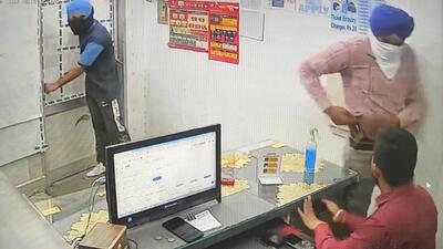 A grab from CCTV footage showing the robbers at the money exchanger office in Ludhiana. (HT Photo)
