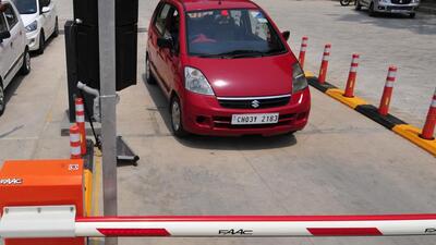 FASTag will allow visitors to simply drive through the parking entry/exit point without stopping for payment. (HT File Photo) FASTag will allow visitors to simply drive through the parking entry/exit point without stopping for payment. (HT File Photo)