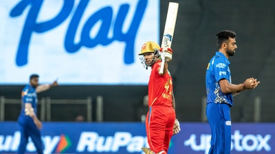 Shikhar Dhawan raises his bat after scoring his 45th IPL fifty (PTI) Shikhar Dhawan raises his bat after scoring his 45th IPL fifty (PTI)