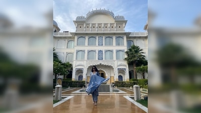 Mouni Roy flaunted her easy-breezy anarkali inspired salwar set as she struck a pose in front of the stunning hotel. (Instagram/@imouniroy)