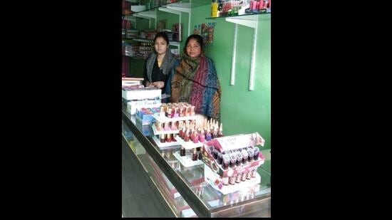 Shimla Devi and Aarti at their cosmetics shop-cum-parlour in Barara town. (HT Photo)