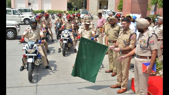 Mohali SSP Vivek Sheel Soni flagging off the motorcycles that will be used by the police for patrolling, at the District Administrative Complex in Sector 76 on Wednesday. (Keshav Singh/HT)