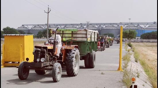 Farmers from nearby villages claim they save time and get hassle-free service at these silos constructed and operated by Adani Agro Logistics at Moga in Punjab. (HT Photo) Farmers from nearby villages claim they save time and get hassle-free service at these silos constructed and operated by Adani Agro Logistics at Moga in Punjab. (HT Photo)