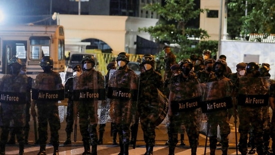 Sri Lanka protests: Air Force members stand guard in front of the Temple Trees Prime Minister Mahinda Rajapaksa's official residence during a protest, amid the country's economic crisis in Colombo.&nbsp;(REUTERS)