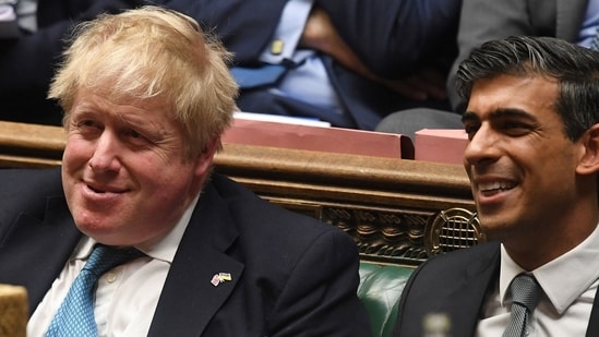 Britain's Prime Minister Boris Johnson (L) and Britain's Chancellor of the Exchequer Rishi Sunak. (Photo by JESSICA TAYLOR/UK PARLIAMENT/AFP) (File Photo)