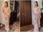 Kareena Kapoor and Saif Ali Khan recently made a stylish appearance at Ranbir Kapoor and Alia Bhatt's wedding which is taking place today, April 14 at Vastu. The couple twinned in blush pink attires. Bebo wore a gorgeous organza zari embroidered saree while Saif complemented his wife in a kurta-pyjama set teamed with a Nehru jacket.(Instagram/@manishmalhotra05)