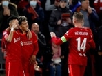Champions League - Quarter Final - Second Leg - Liverpool v Benfica - Anfield, Liverpool, Britain - April 13, 2022 Liverpool's Roberto Firmino celebrates scoring their second goal with Luis Diaz and Jordan Henderson