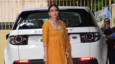 Karisma Kapoor poses after the mehendi ceremony. 