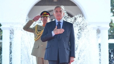 Pakistan's Prime Minister Shehbaz Sharif gestures during the guard of honour ceremony at the Prime Minister house in Islamabad,&nbsp; (via REUTERS)