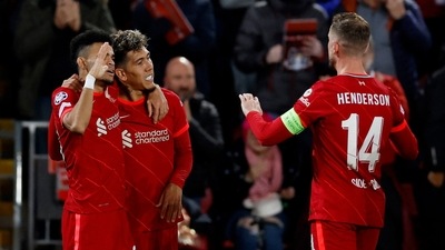 Champions League - Quarter Final - Second Leg - Liverpool v Benfica - Anfield, Liverpool, Britain - April 13, 2022 Liverpool's Roberto Firmino celebrates scoring their second goal with Luis Diaz and Jordan Henderson (Action Images via Reuters)