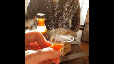 The orange peel being squeezed in the sunlight in this Reddit video. (reddit/@solateor) The orange peel being squeezed in the sunlight in this Reddit video. (reddit/@solateor)